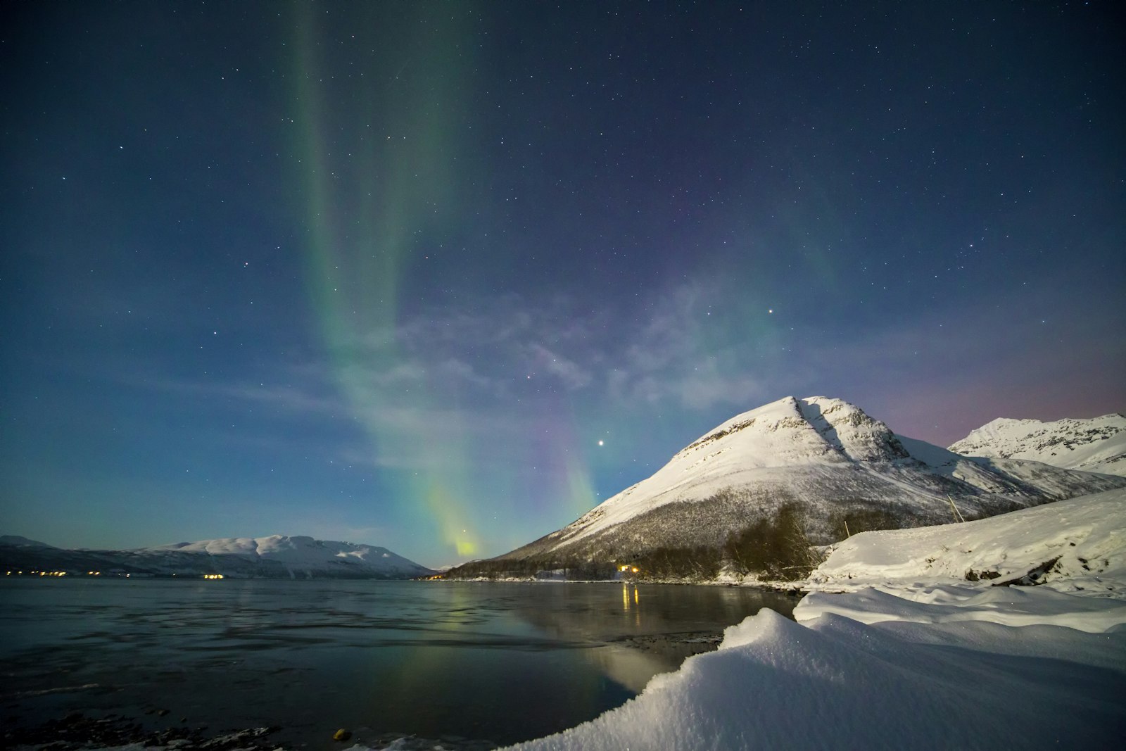Small group of travelers on a shared Northern Lights tour in Norway